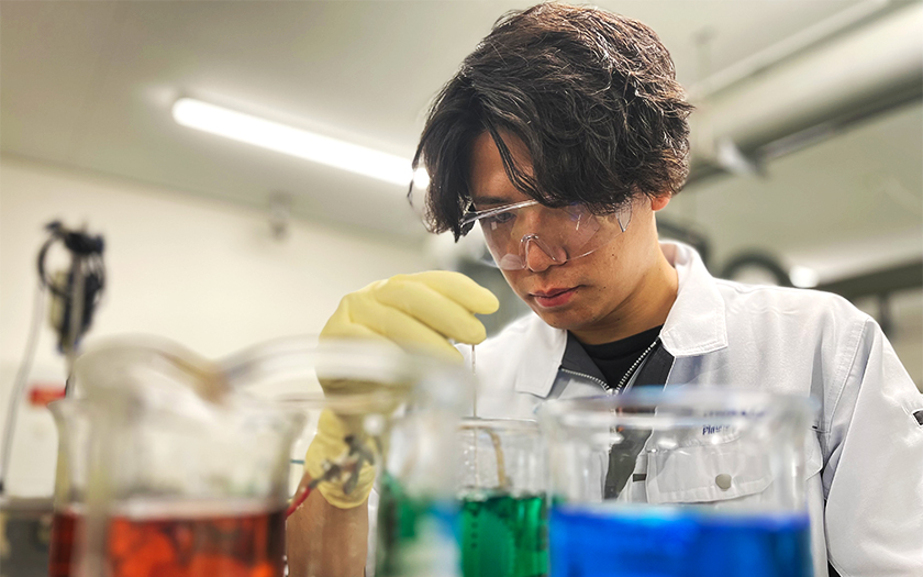 A Kiyokawa technician working with chemical solution in plating laboratory.