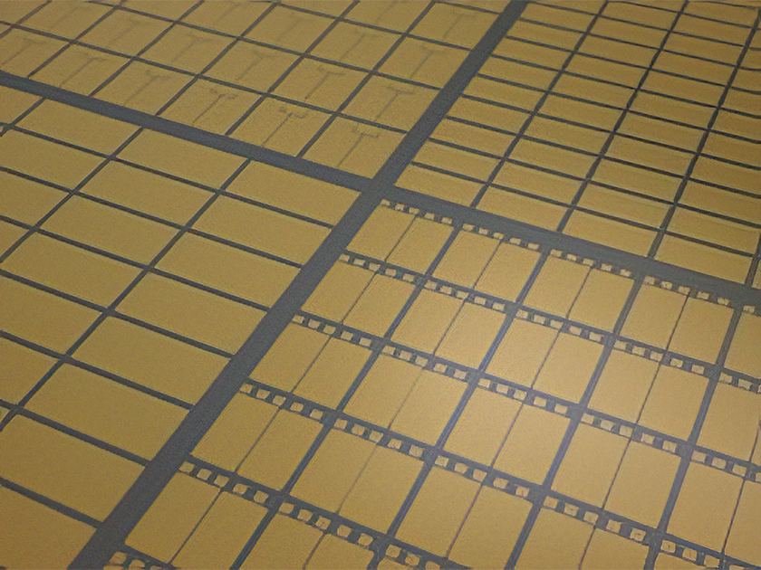 Close-up of semiconductor wafer with UBM plating for robust bonding and corrosion resistance.
